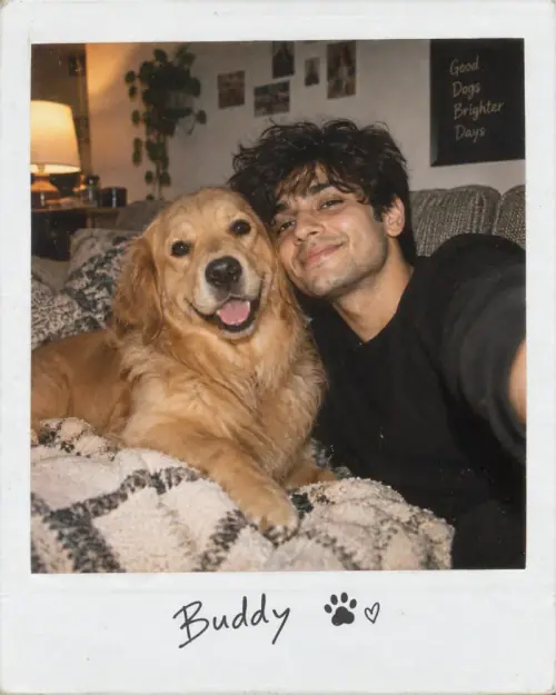 Pet and Owner AI Prompt showing a fluffy dog and its owner sitting together on a cozy couch in a warm Polaroid-style portrait.